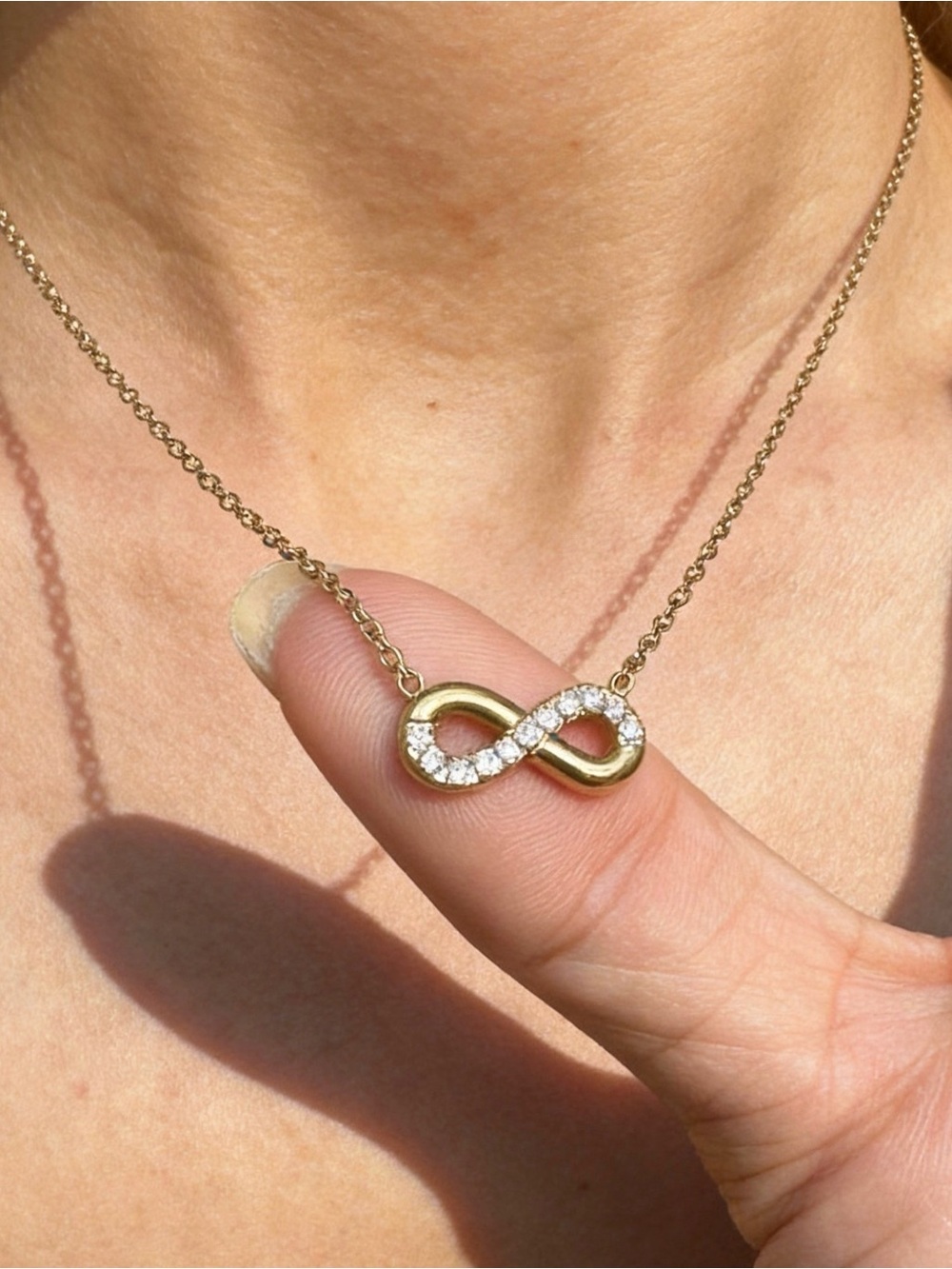 Gold Infinity Pendant Necklace with Clear Stones